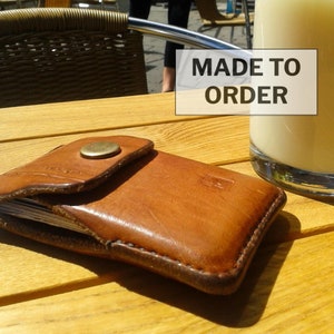 Leather card and bank notes wallet. Pocket size