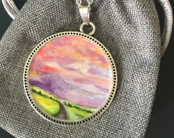 Sunset drive, hand painted round pendant with 18 inch necklace, silver tone finish