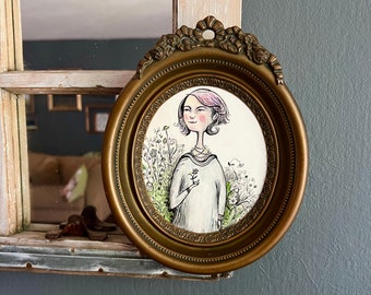 Bloom, a whimsical painting, lady with flowers, in a vintage oval frame, 8.5 x 7 in. plastic, bronze color