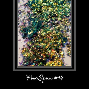 May include: Close-up of iridescent glitter flakes in shades of green, gold, and purple. The glitter is scattered across a white background, creating a shimmering effect. The text "Fine Spun #14" is written in cursive at the bottom.