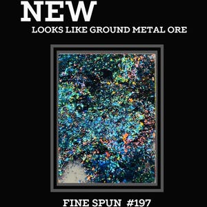 May include: A close-up of iridescent blue, green, and orange glitter. The glitter is in a square frame with the text "FINE SPUN #197" below the frame. The text above the frame reads "NEW LOOKS LIKE GROUND METAL ORE".