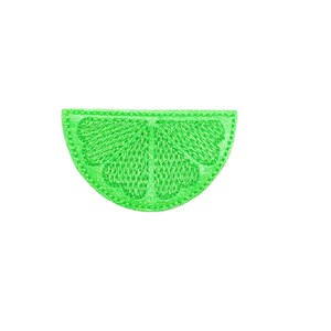 May include: A green felt lime wedge applique with a stitched design.