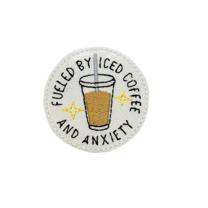 May include: White embroidered patch with a black outline. The patch features a cup of iced coffee with a straw and the text "Fueled by Iced Coffee and Anxiety".