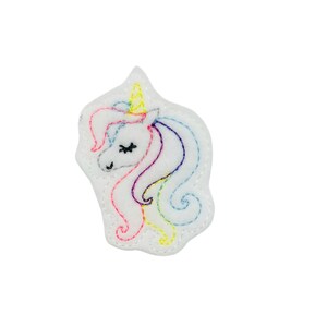 May include: White felt unicorn applique with a rainbow mane and horn. The unicorn has closed eyes and a smiling expression.
