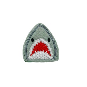May include: A gray felt shark patch with a red and white embroidered mouth.
