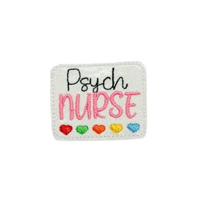 May include: White iron-on patch with pink glitter and the text "Psych Nurse" in black and pink embroidery. A row of six rainbow-colored hearts are below the text.