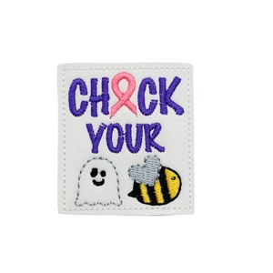 May include: White embroidered patch with purple text that reads "Check Your" with a pink ribbon above the text. There is a white ghost with a smiley face and a yellow and black bee with a gray heart on the bottom of the patch.