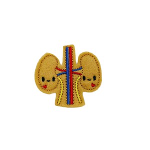 May include: A felt patch of a pair of kidneys with smiling faces and red and blue veins. The kidneys are a light brown color.