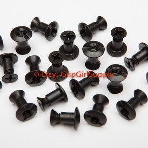 May include: A close-up of 18 black, metal, round-headed screws with a star-shaped head. The screws have a raised, round base and a threaded shaft.