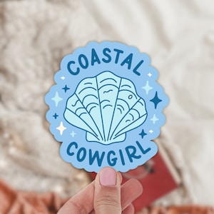 May include: A blue sticker with a seashell and the text "Coastal Cowgirl".