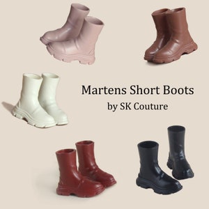 May include: Four pairs of short boots in different colors: brown, black, white, and red. The boots have a chunky platform sole and a short, ankle-length shaft. The text "Martens Short Boots by SK Couture" is displayed in the center of the image.