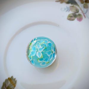 Hibiscus collector marbles, 22mm size turquoise blue marbles with white flower, cobble size collector marble, handmade glass marble