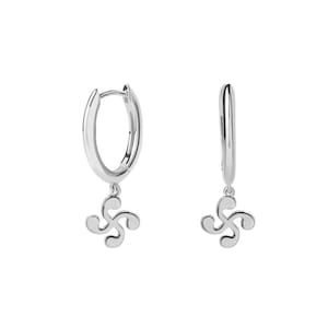 May include: Silver hoop earrings with a dangling Celtic knot charm. The earrings are a simple and elegant design.