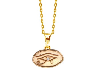 Eye of Horus circle pendant Gold Plated 18k, handmade. Wedjat eye simbol of Ancient Egypt. Eye of Ra, represents well-being. Chain included.