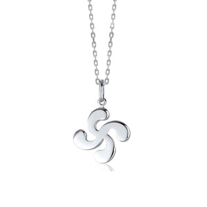 May include: A silver-toned necklace featuring a pendant shaped like a four-armed curved cross, known as a Lauburu, suspended from a delicate link chain. The metal surface is smooth and reflective, showcasing a polished finish throughout the piece.