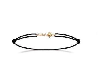Eguzkilore armband 18K guldpläterat med kubisk zirkonia (19 cm) med snöre – baskiska smycken. Eguzkilore armband, handgjort. Baskisk symbol.