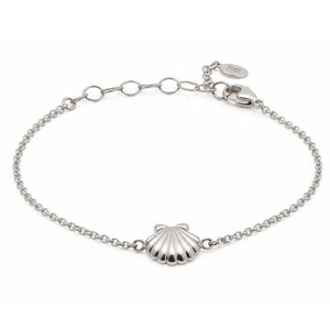May include: A silver-toned chain bracelet featuring a central seashell charm. The bracelet includes a delicate link chain, a lobster claw clasp, and an adjustable extension chain with a small circular tag attached at the end of the closure mechanism.