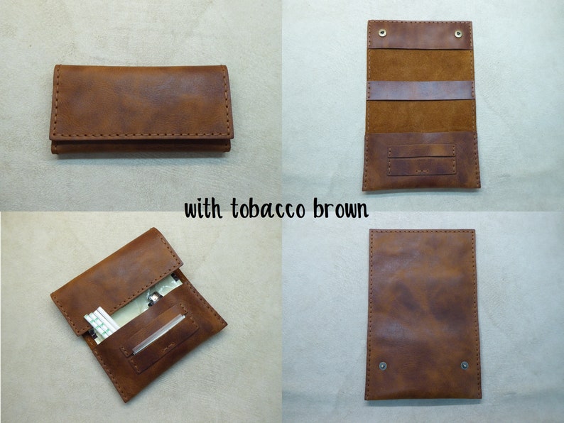 May include: A brown leather cigarette case with a flap closure and a stitched design. The case is open to reveal a compartment for cigarettes and a smaller compartment for a lighter or other small items. The case is labeled "with tobacco brown".