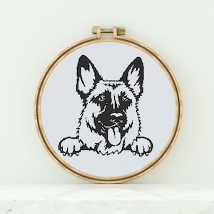 May include: Black and white illustration of a German Shepherd dog peeking over a white surface. The dog has its tongue sticking out and is looking directly at the viewer.