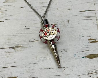 Steampunk pendant necklace made with bullet and bejeweled vintage watch movement