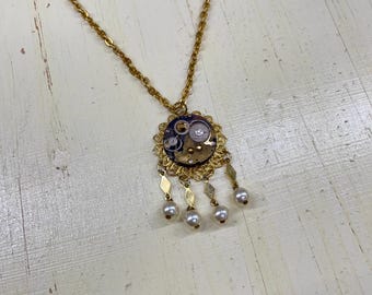 Steampunk necklace-Bejeweled vintage brass watch movement on wings