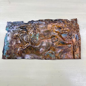 May include: A set of three ceramic mugs with a speckled, matte finish. The mugs are in shades of cream, light gray, and dark gray. Each mug has a simple, minimalist design, perfect for coffee or tea.