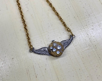 Steampunk necklace-Bejeweled vintage brass watch movement on wings