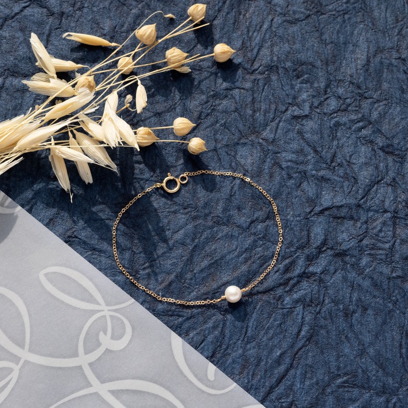 a close up of a bracelet on a table