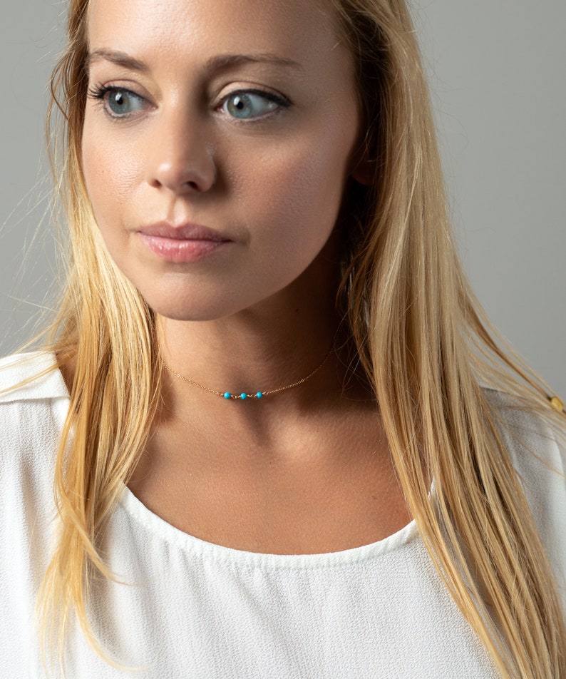 a woman with long blonde hair and blue eyes