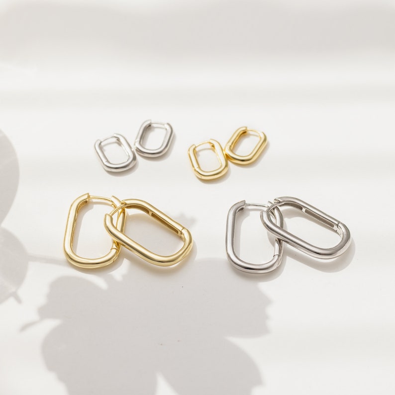 three pairs of gold and silver paper clips