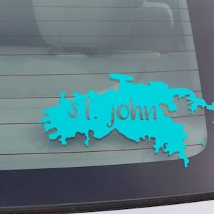 May include: A turquoise blue car decal of the outline of St. John Island with the text "St. John" inside the outline.
