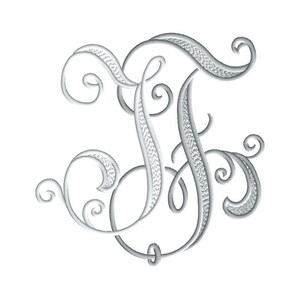 May include: A silver embroidered monogram of the letter F with decorative flourishes.