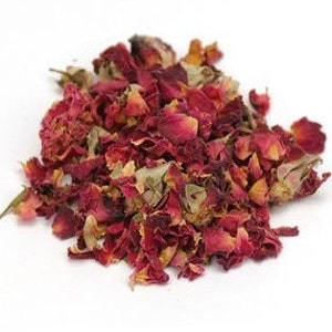 May include: Dried rose petals in shades of red, pink, and white. The petals are loose and scattered, with some buds and leaves mixed in.