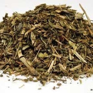 May include: A pile of dried herbs, a blend of green and brown, with some small, dark seeds scattered throughout.