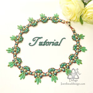 May include: A green and white beaded necklace with a floral design. The necklace is made with small seed beads and has a silver clasp. The word "Tutorial" is written in cursive on a white background.