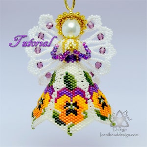 May include: A beaded angel ornament with white, purple, green, orange, and black beads. The angel has wings, a halo, and a dress with a floral pattern. The ornament is labeled "Tutorial".