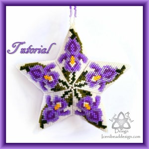 May include: A purple and white beaded star ornament with a floral design. The star is hanging from a white string and has a green leaf design around the flowers. The text "Tutorial" is written in cursive at the top of the image. The text "Iceni Bead Design" is written at the bottom of the image.