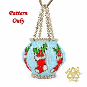 May include: A beaded ornament featuring a light blue background with a repeating pattern of red Christmas stockings and green holly leaves. The ornament has a silver beaded handle and base. Text reads Pattern Only.