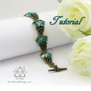 May include: A teal and gold beaded bracelet with a toggle clasp, displayed on a white surface. The word "Tutorial" is written in teal script. The bracelet is a handmade jewellery item. The design incorporates rectangular and oval beads.
