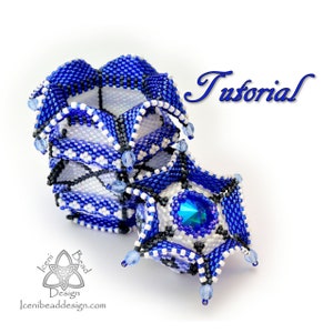 May include: A blue and white beaded jewellery piece with a crystal centre. The piece is shaped like a flower and has a tutorial label.