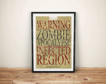 May include: A black framed poster with a distressed, vintage-style design. The text reads "WARNING ZOMBIE APOCALYPSE INFECTED REGION" in red and black lettering on a beige background.