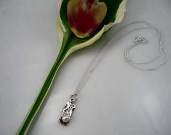 Small sterling silver and white pearl pendant