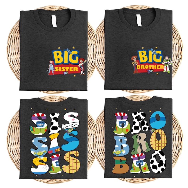four black t-shirts with colorful text and characters, including the characters from the Toy Story franchise. The t-shirts are arranged in a grid-like pattern, with each shirt having a different design.