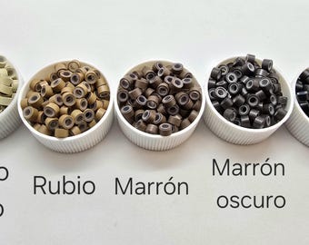 Puede incluir: Cinco boles pequeños de microanillos para extensiones de cabello en diferentes colores: rubio claro, rubio, marrón, marrón oscuro y negro.