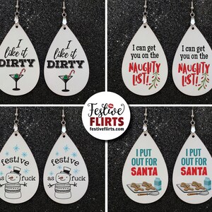 May include: White teardrop earrings with various holiday-themed designs. One pair says "I like it DIRTY" with a martini glass. Another says "I can get you on the NAUGHTY LIST!" A third pair says "festive as fuck" with a snowman. The last pair says "I PUT OUT FOR SANTA".