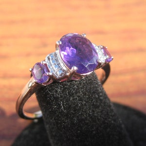 Tri Stone Amethyst (9x7mm and two 4x3mm) Faceted Gemstones Sterling Silver Ring with Rose Gold Overlay Size 10, Item #149
