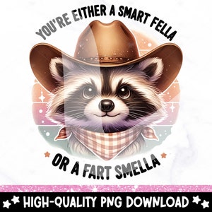 May include: A cartoon raccoon wearing a cowboy hat and bandana with the text "You're either a smart fella or a fart smella" in a retro style.