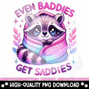 Puede incluir: Un adorable dibujo animado de mapache envuelto en una manta rosa y azul con el texto "Even Baddies Get Saddies".