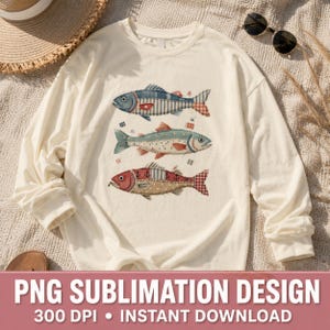 May include: A cream-coloured long-sleeved shirt with three decorative fish designs. Each fish has a unique pattern, including stripes, polka dots, and plaid, in shades of blue, red, and beige. The text "PNG SUBLIMATION DESIGN" is at the bottom.
