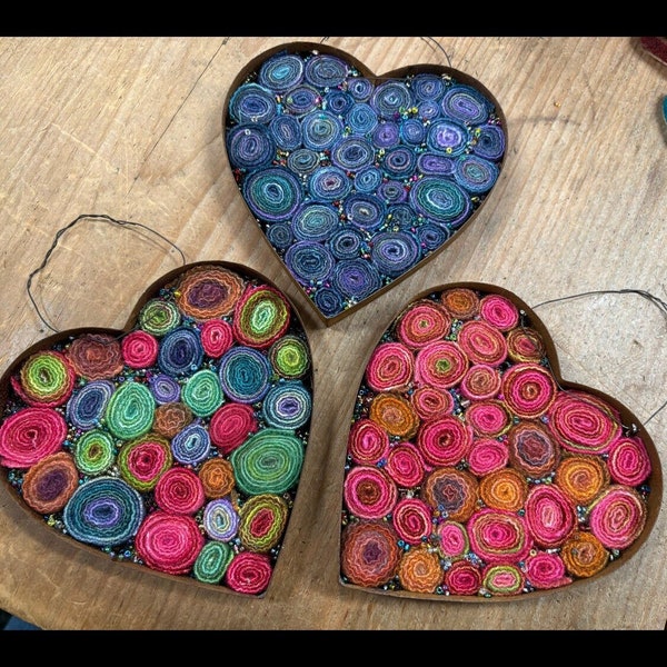 Rusty tin heart with wool quills